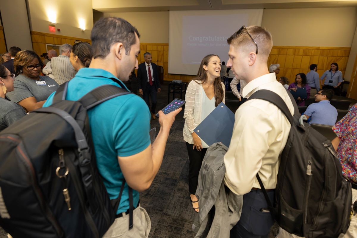 People standing around talking at the 2023 Honors and Awards Ceremony